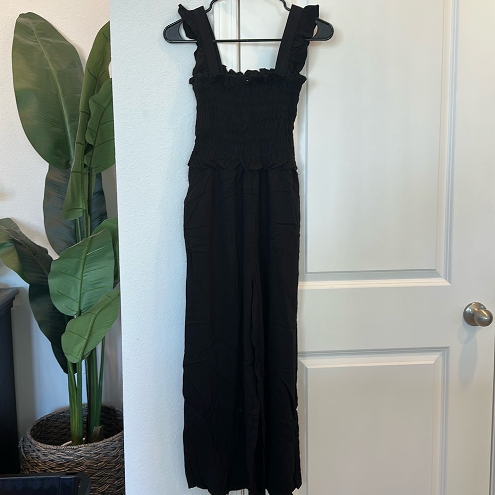 NWOT Shop The Mint Jumpsuit. Size Medium. Black. Has pockets. Never worn.